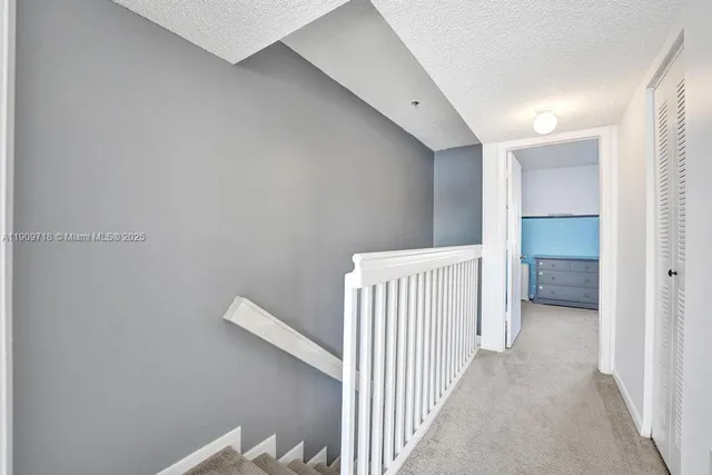 a bathroom with a toilet and a shower curtain