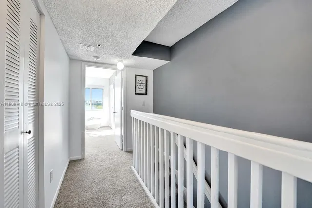a white bath tub sitting next to a white toilet