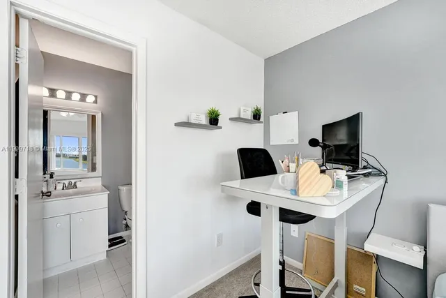 a view of a house with pool and sitting area