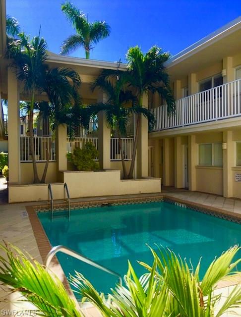 175 5th Avenue South, Unit 104 Naples, FL 34102 - Photo 1 of 9 a view of a house with a patio