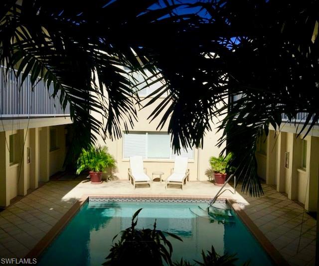 175 5th Avenue South, Unit 104 Naples, FL 34102 - Photo 4 of 9 a view of swimming pool with a patio