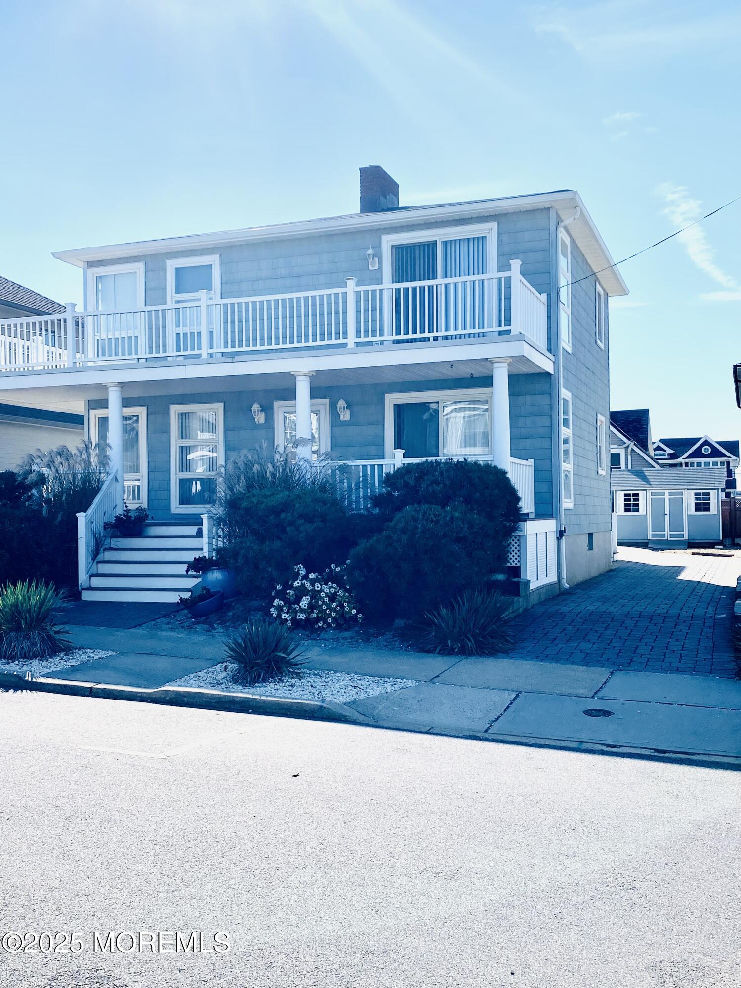 4 Camden Avenue, Unit DOWN Lavallette, NJ 08735 - Photo 4 of 14 a view of a house with a patio