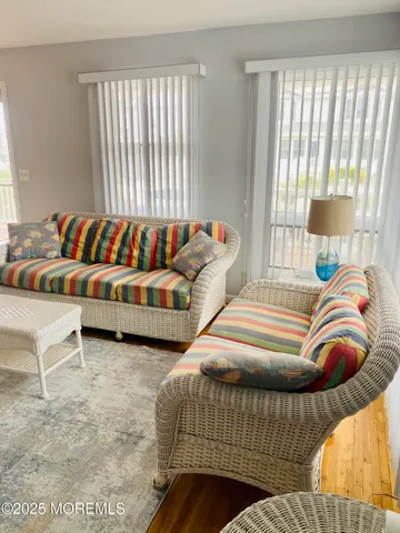 a bedroom with two beds and a couch