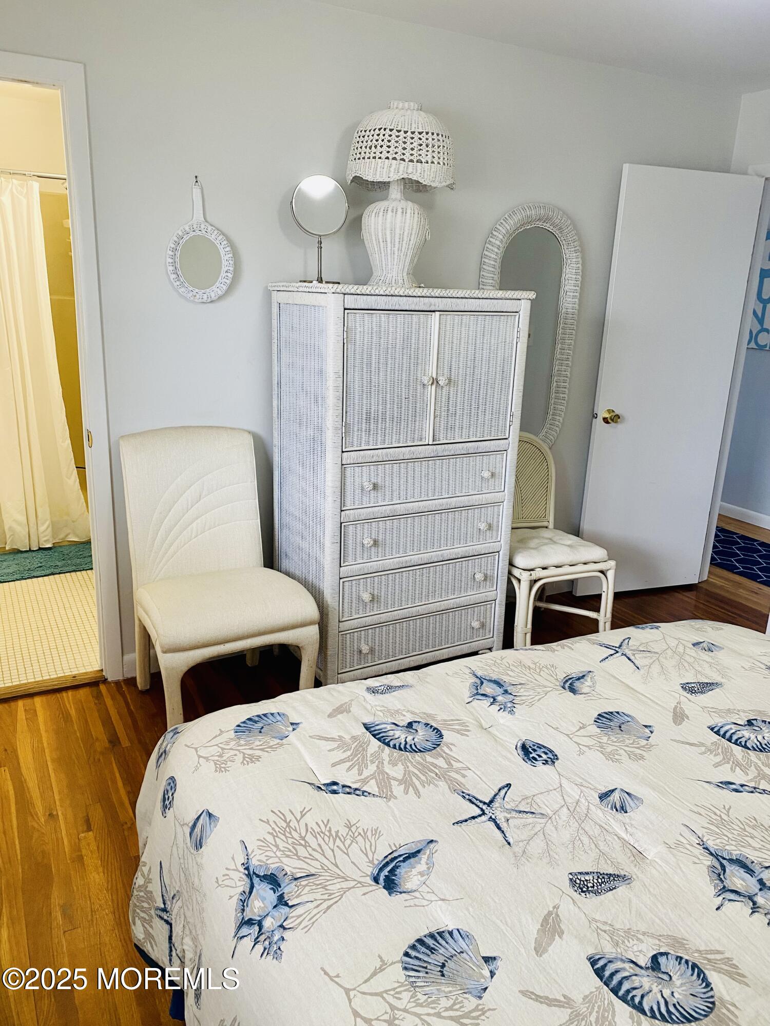 4 Camden Avenue, Unit DOWN Lavallette, NJ 08735 - Photo 10 of 14 a bedroom with a bed and wooden floor