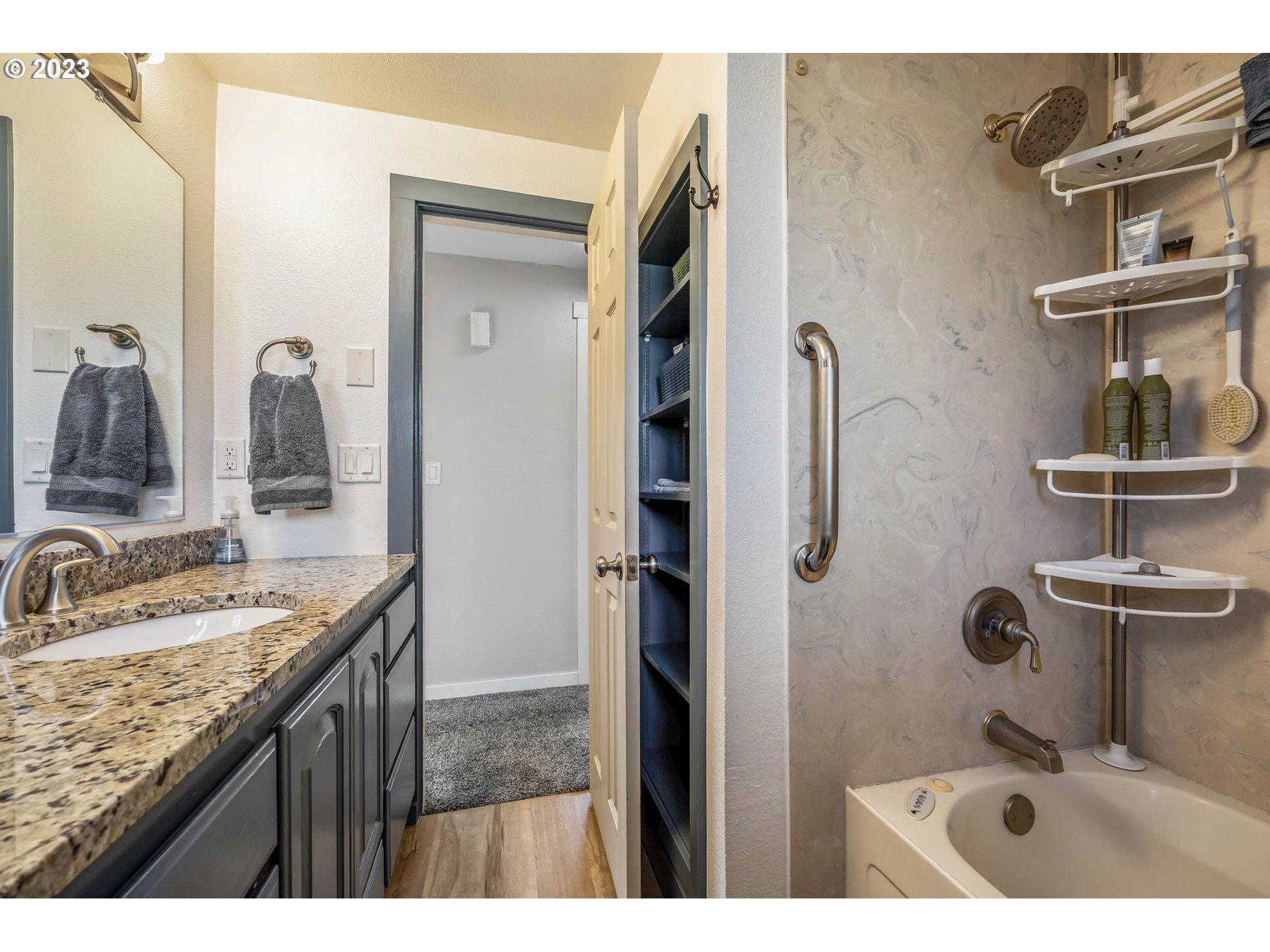1083 Quinalt Street Springfield, OR 97477 - Photo 24 of 39 a bathroom with a granite countertop sink and a mirror
