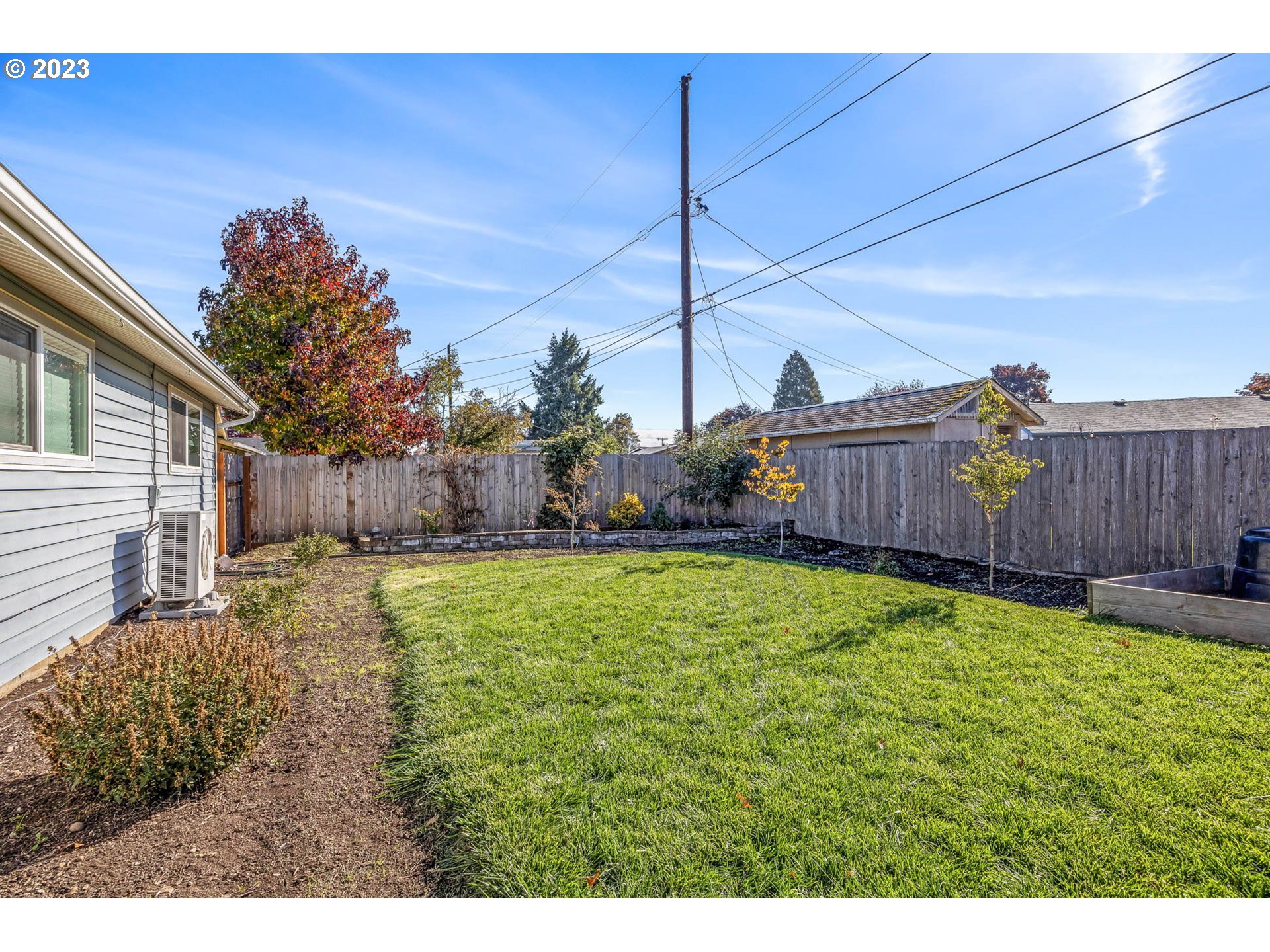 1083 Quinalt Street Springfield, OR 97477 - Photo 36 of 39 a view of a house with backyard and a tree