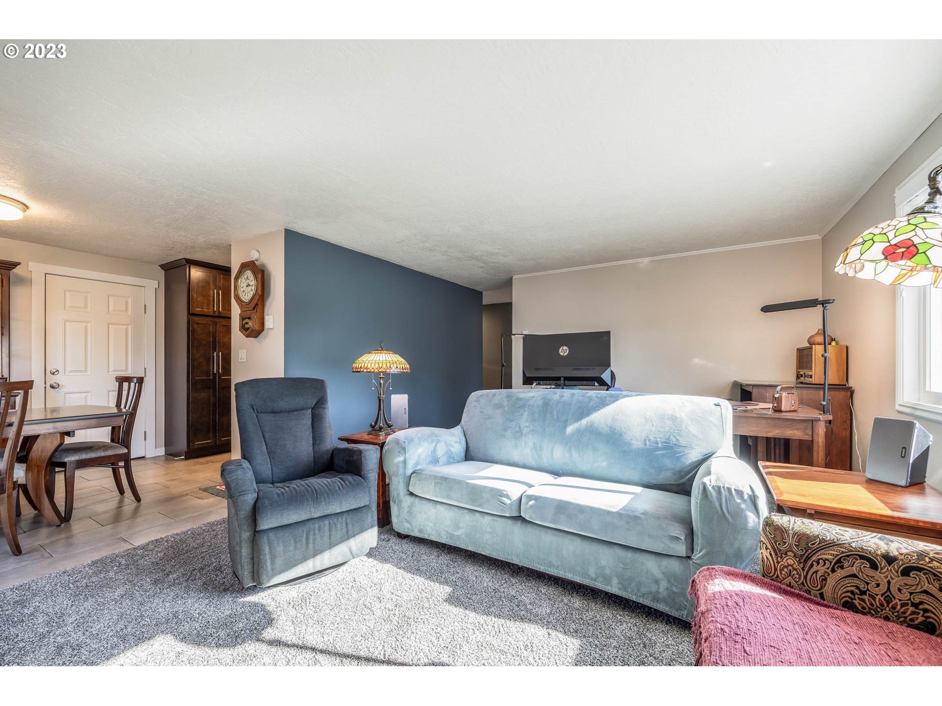 1083 Quinalt Street Springfield, OR 97477 - Photo 6 of 39 a living room with furniture and a lamp
