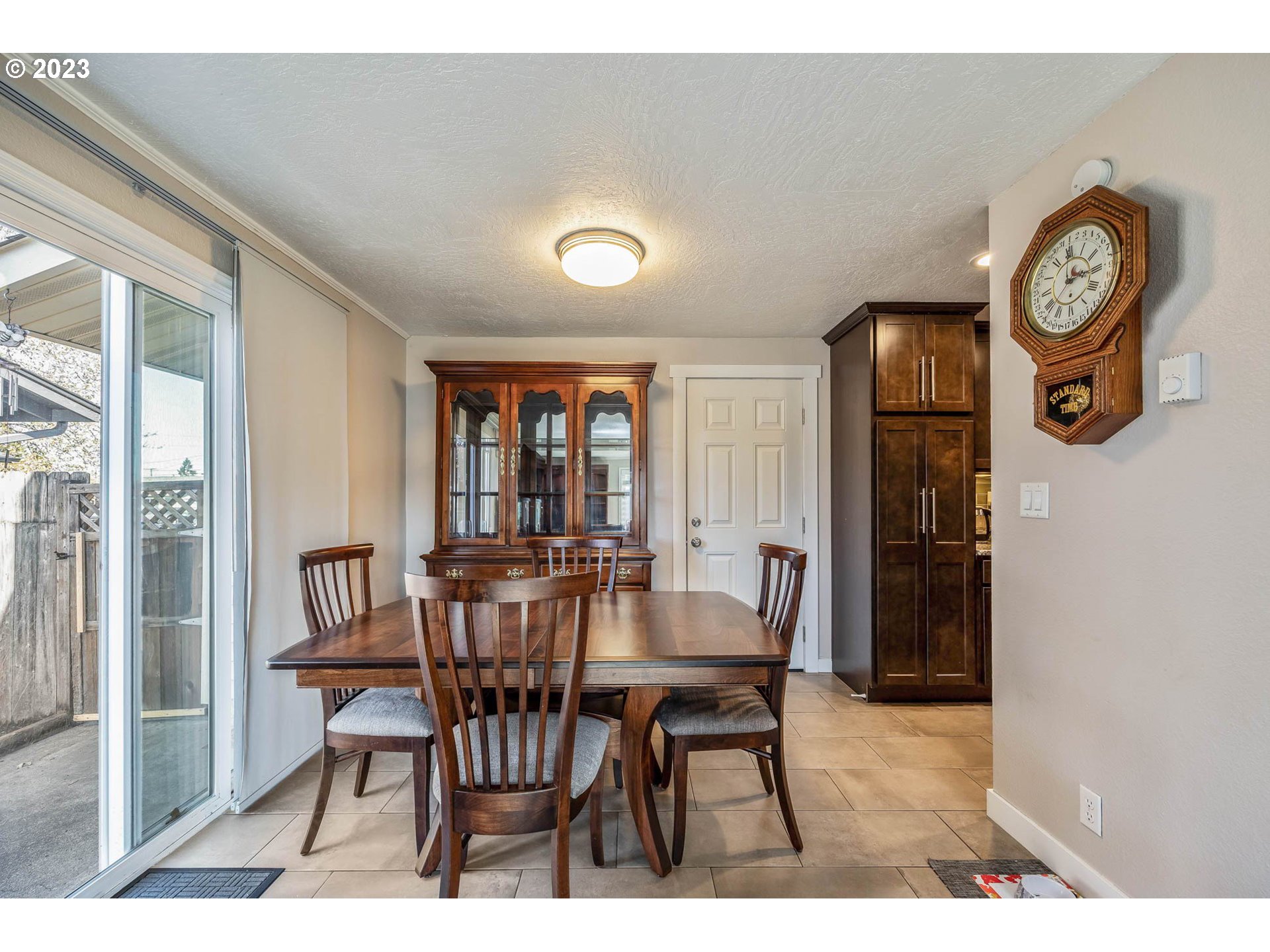 1083 Quinalt Street Springfield, OR 97477 - Photo 9 of 39 a view of a dining room with furniture and a large window