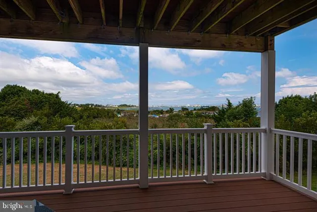 a living room with furniture a rug and a painting
