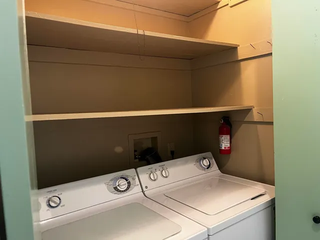 a bathroom with a shower curtain and a toilet