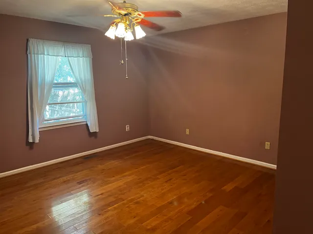a bathroom with a sink vanity and a toilet