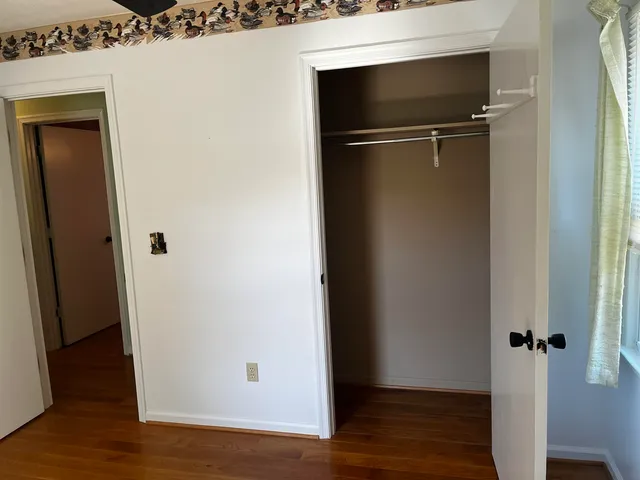 a house that has a big yard with wooden fence