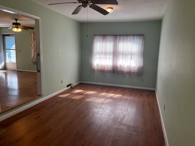 a bathroom with a window and a shower