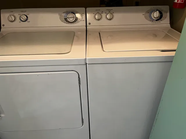 an empty room with wooden floor and closet