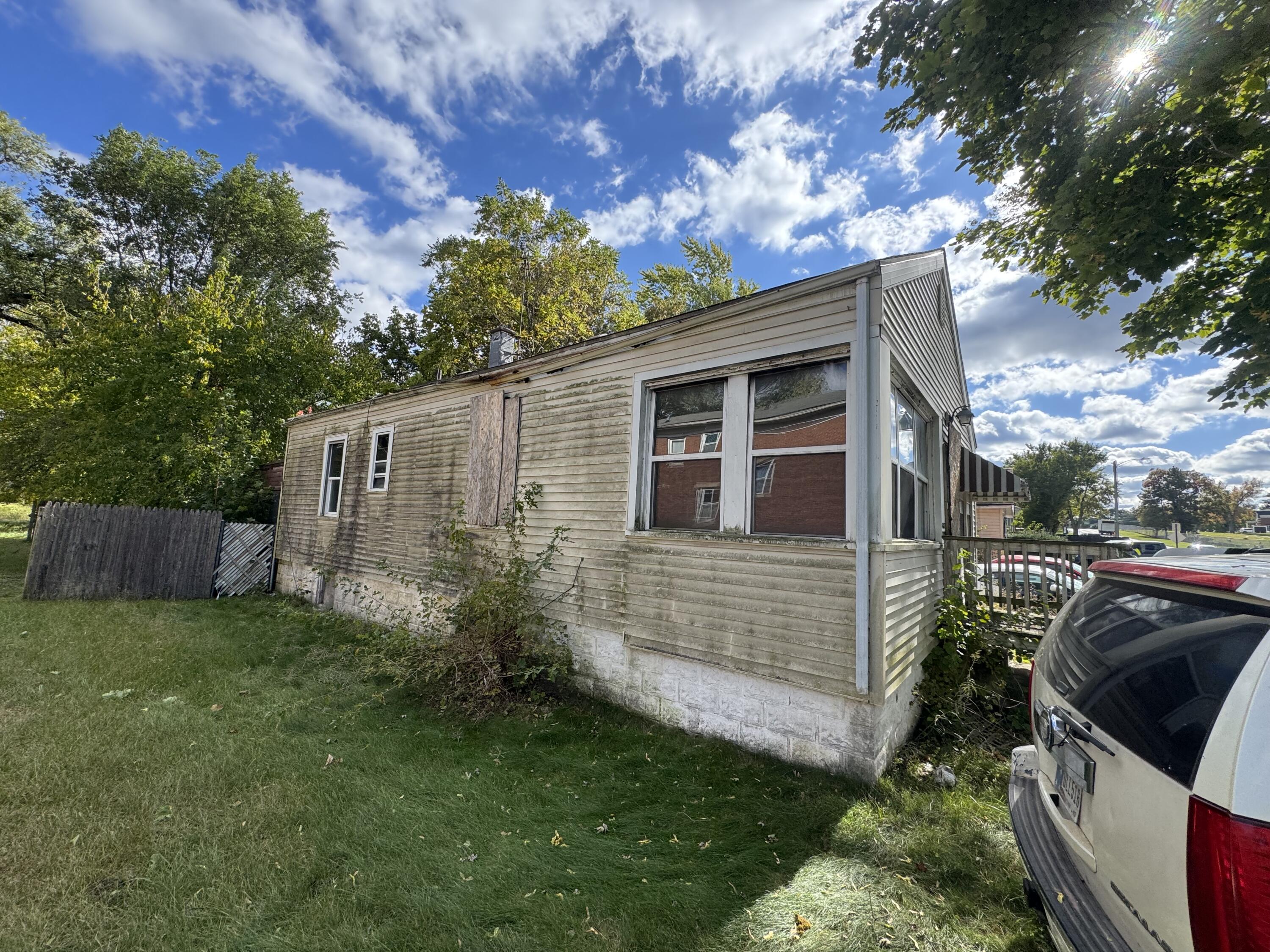4317 Harrison Street Gary, IN 46408 - Photo 2 of 4 a view of backyard with barbeque grill and a large tree