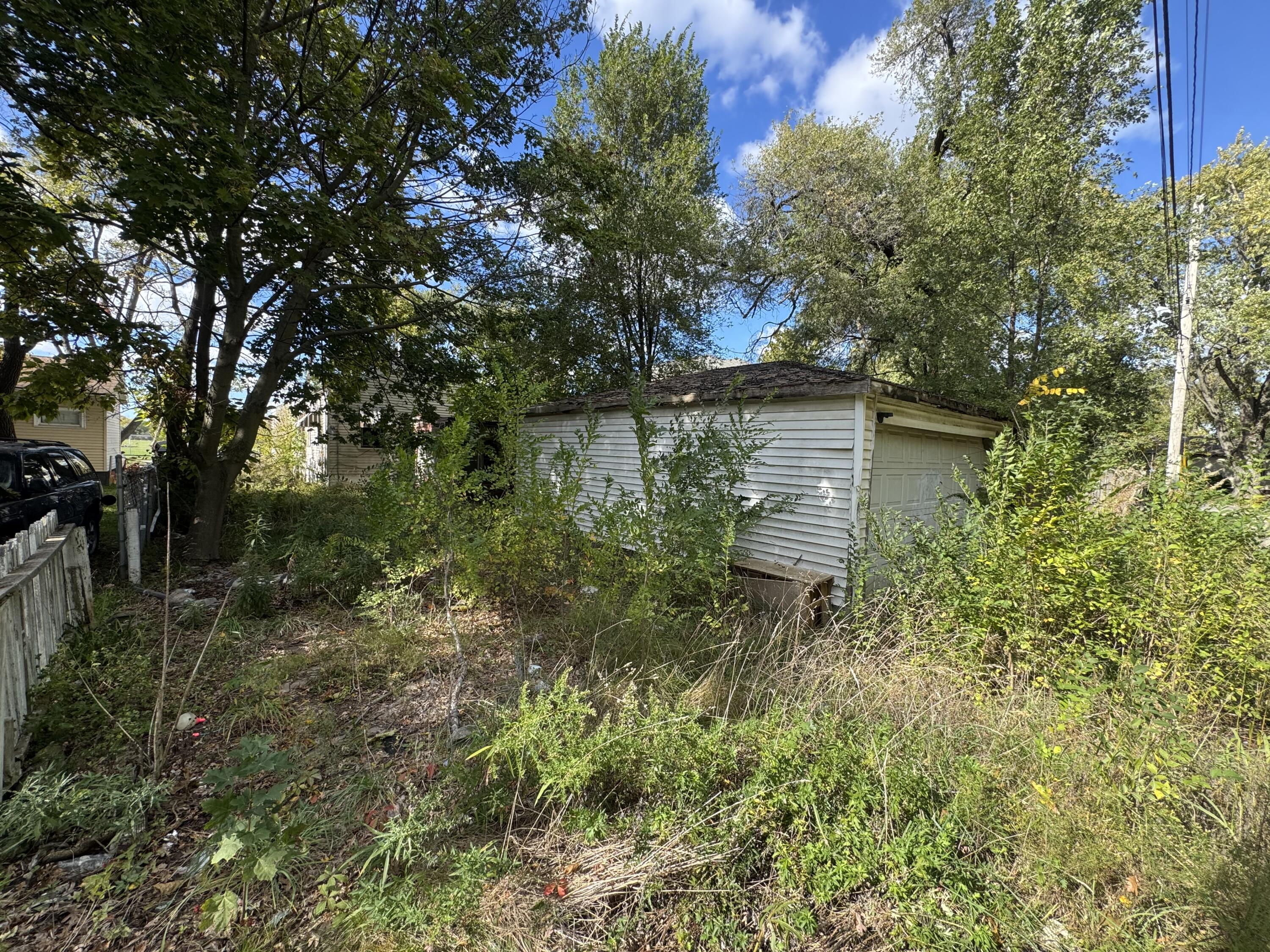 4317 Harrison Street Gary, IN 46408 - Photo 4 of 4 a backyard of a house with lots of green space and lake view