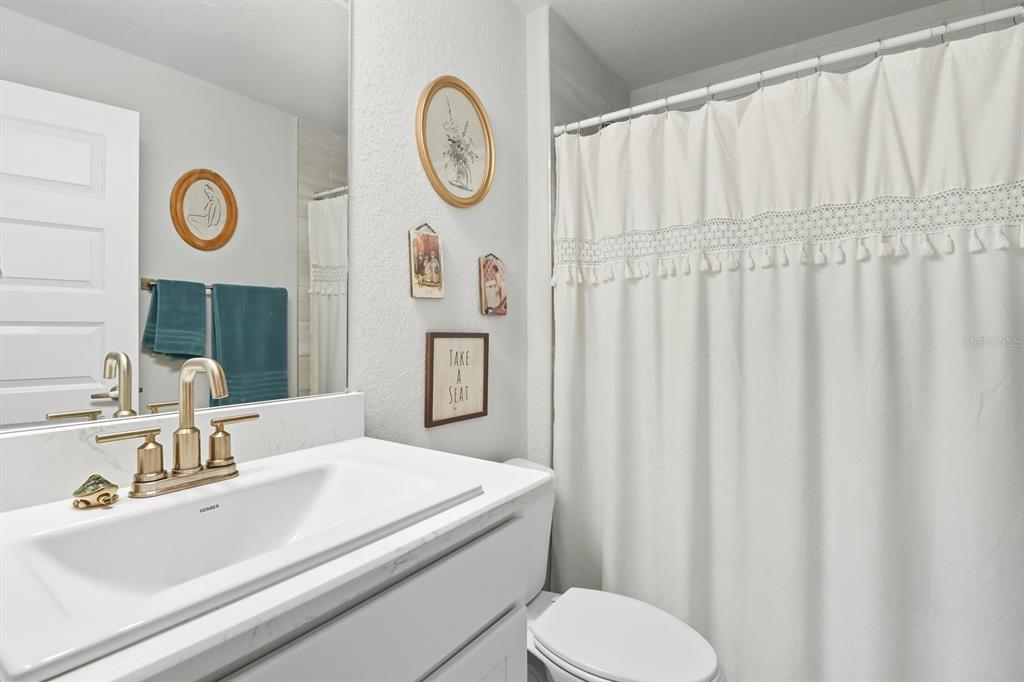 6788 Southwest 179th Ave Road Dunnellon, FL 34432 - Photo 16 of 23 a bathroom with a sink and a mirror