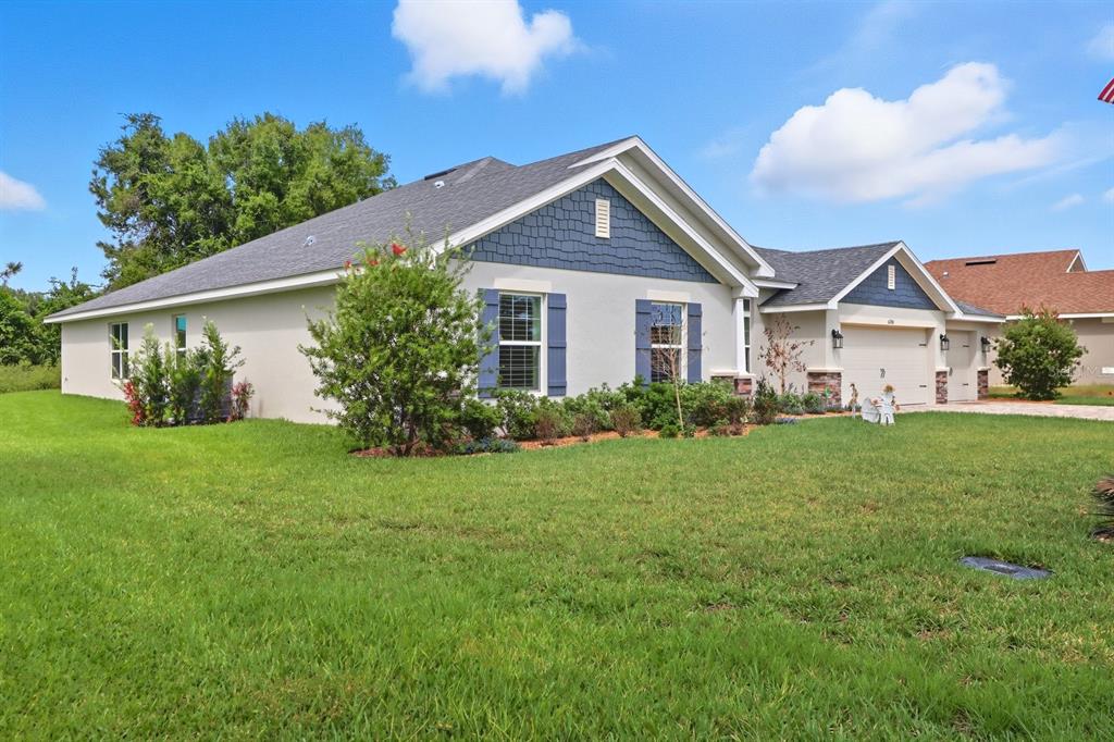 6788 Southwest 179th Ave Road Dunnellon, FL 34432 - Photo 2 of 23 a front view of a house with garden