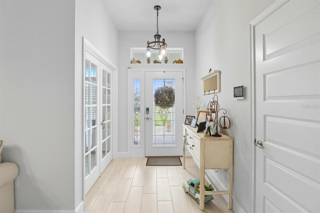 6788 Southwest 179th Ave Road Dunnellon, FL 34432 - Photo 3 of 23 a view of a hallway with a livingroom and dining room view