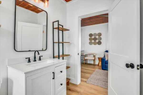 a bedroom with a bed and flat screen tv