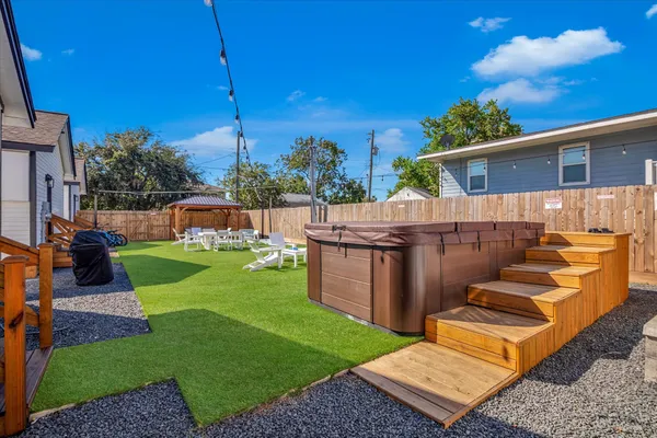 a view of an house with backyard porch and furniture