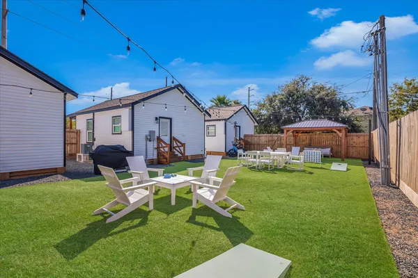 a view of a two chairs in the backyard