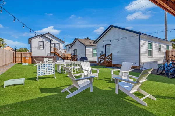 an aerial view of a houses with a yard