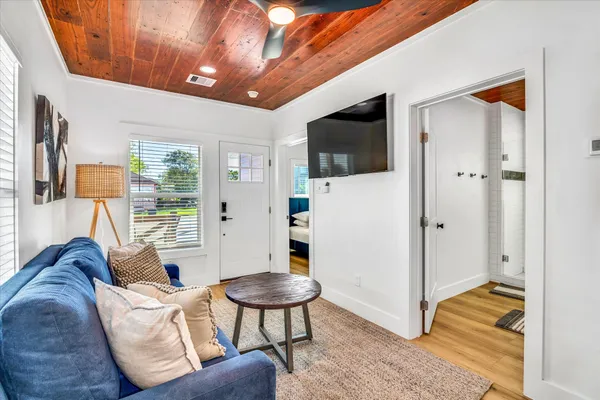 a living room with furniture and a flat screen tv