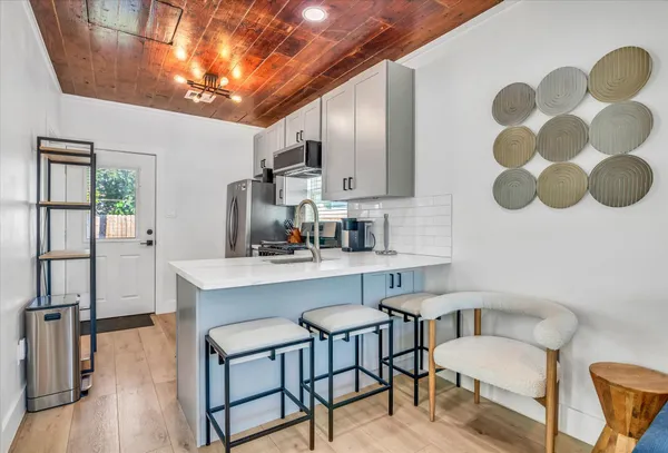 a kitchen with a sink cabinets and window