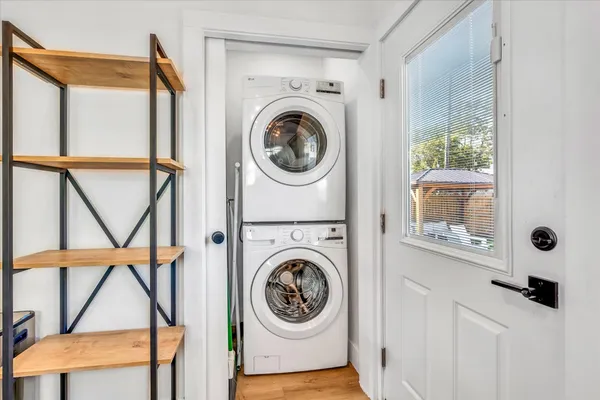 a bedroom with bed and window