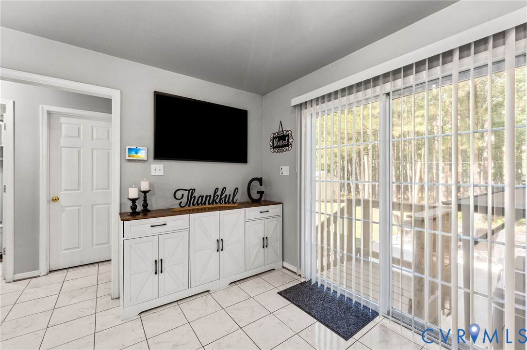 3120 Denise Road Petersburg, VA 23805 - Photo 24 of 51 Sliding glass door with vertical blinds leading to