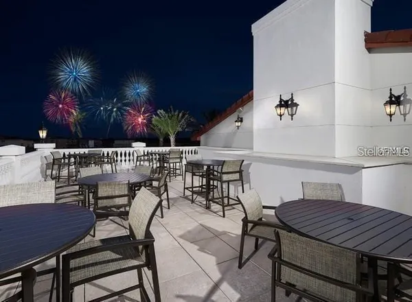 a view of a dinning tables and chairs in patio