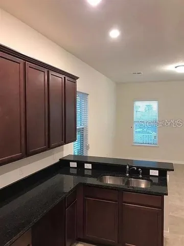 a kitchen with a sink and cabinets