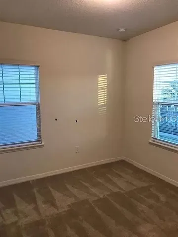 a view of a room that has a window in it