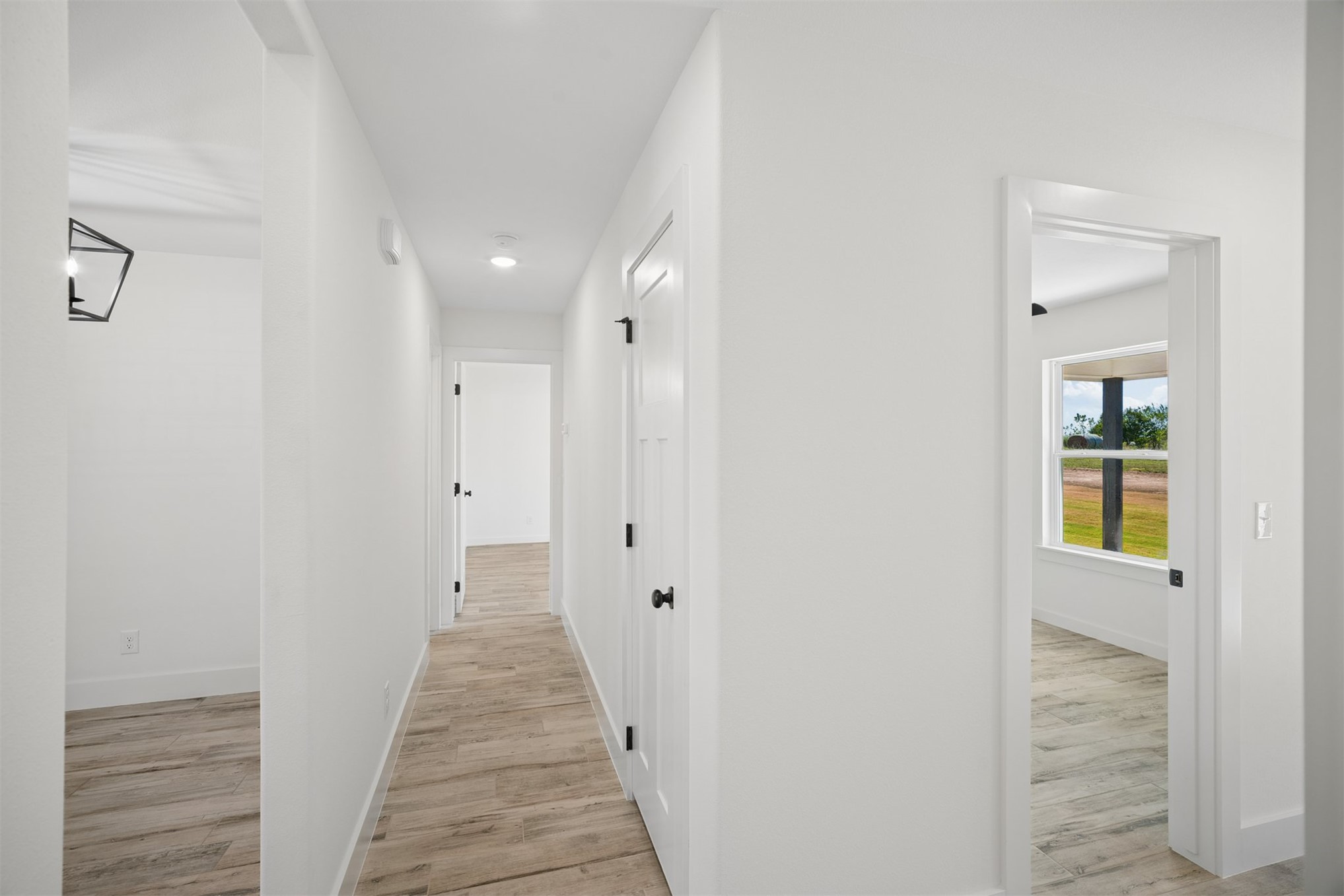25036 South 4205 Road Inola, OK 74036 - Photo 18 of 30 Hallway with wood-finish flooring, recessed lighting, and white paneled doors