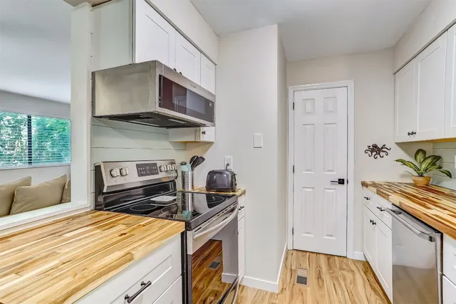 a kitchen with a stove and a microwave