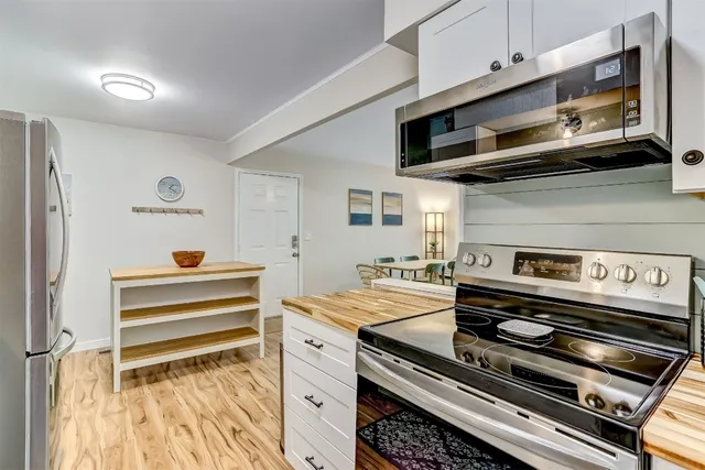 a kitchen with a stove and a microwave