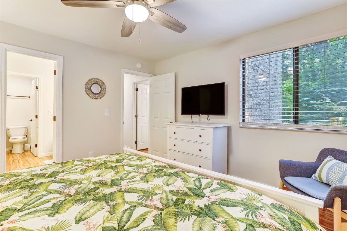2563 Forest Ridge Drive, Unit P3 Fernandina Beach, FL 32034 - Photo 22 of 44 a bedroom with a flat screen tv and a bed