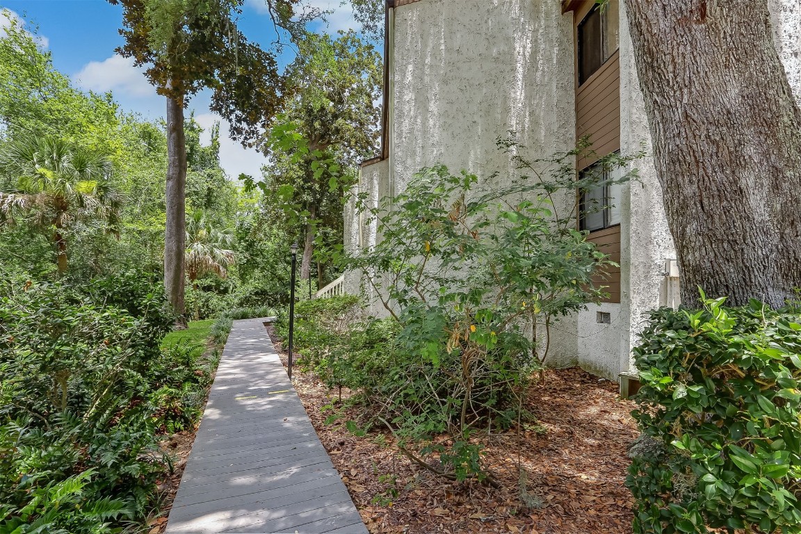 2563 Forest Ridge Drive, Unit P3 Fernandina Beach, FL 32034 - Photo 4 of 44 a view of a pathway with plants