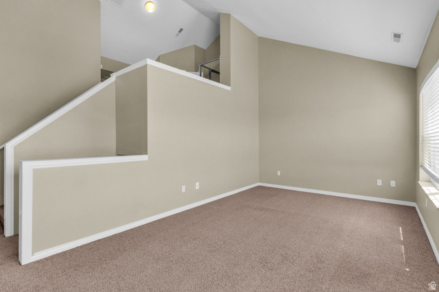 14108 Pepi Band Road Draper, UT 84020 - Photo 17 of 36 Carpeted room featuring a distinctive vaulted ceiling, a staircase with white trim, and a window with horizontal blinds