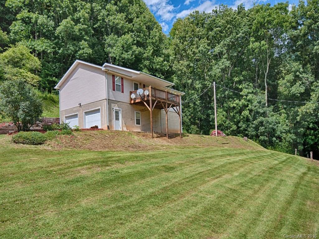 1059 Sugar Cove Road Clyde, NC 28721 - Photo 1 of 14 a front view of a house with a yard