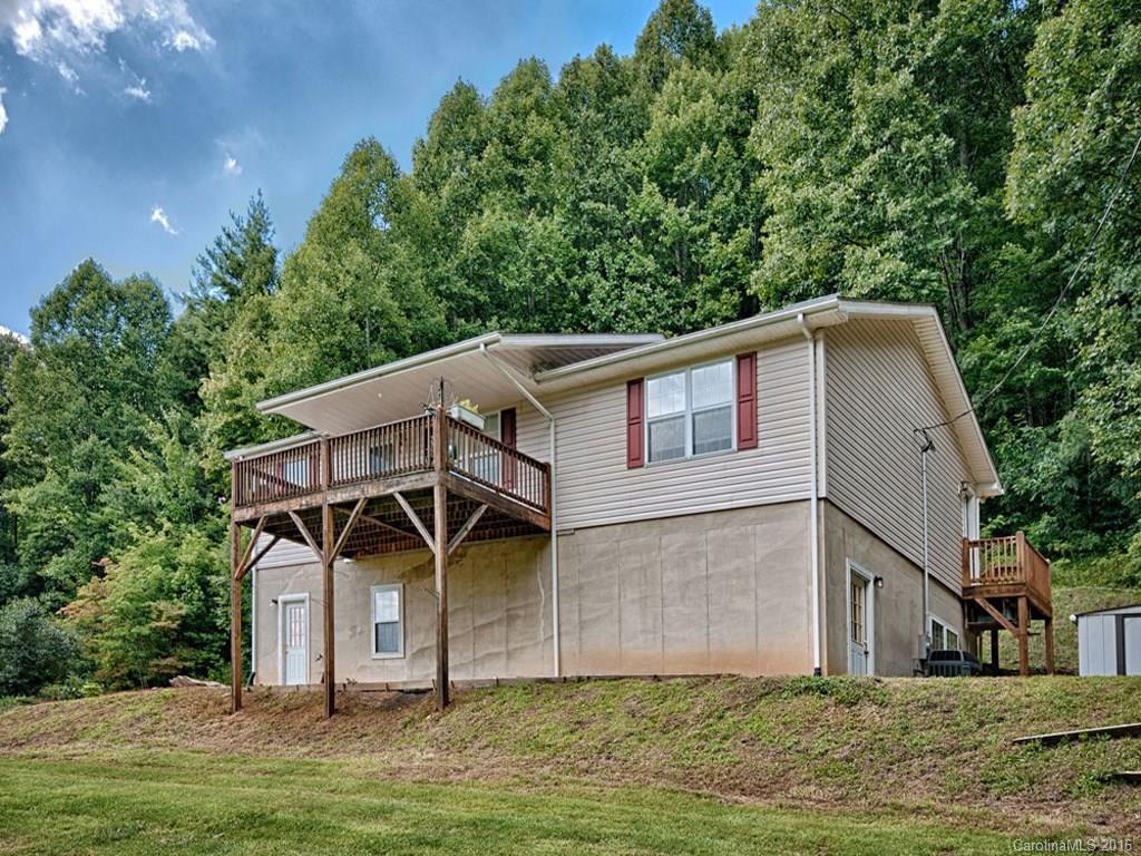 1059 Sugar Cove Road Clyde, NC 28721 - Photo 11 of 14 a house that has a tree in front of it