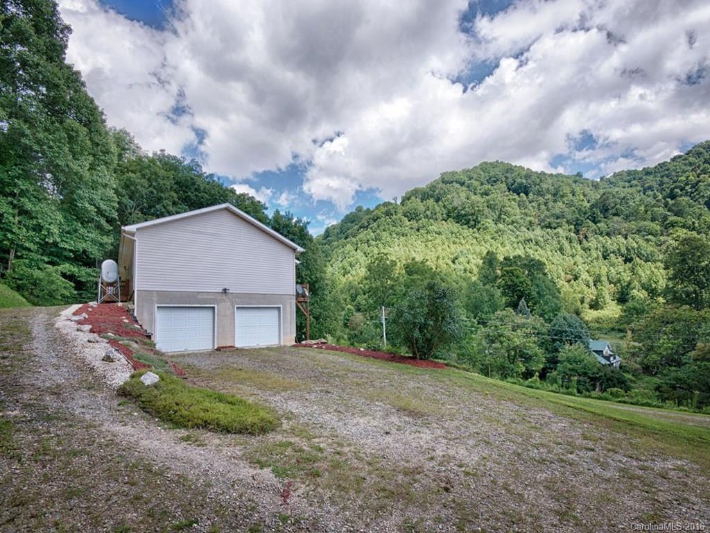 1059 Sugar Cove Road Clyde, NC 28721 - Photo 13 of 14 a view of a house with a yard