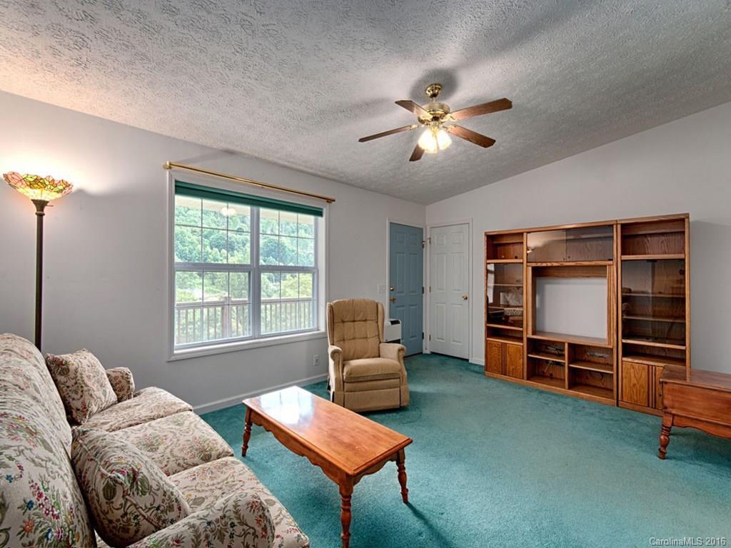 1059 Sugar Cove Road Clyde, NC 28721 - Photo 3 of 14 a living room with furniture and a window