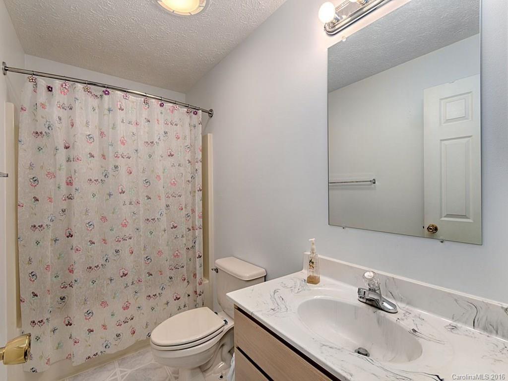 1059 Sugar Cove Road Clyde, NC 28721 - Photo 6 of 14 a bathroom with a sink toilet and shower