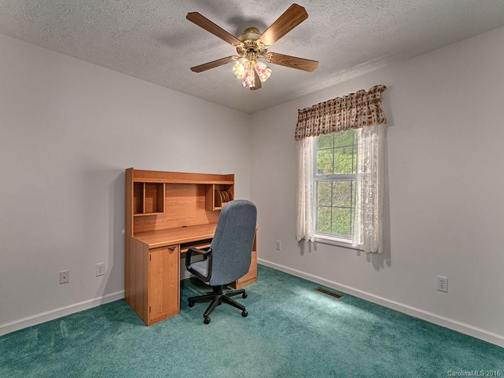 1059 Sugar Cove Road Clyde, NC 28721 - Photo 7 of 14 a view of a workspace with furniture and a window
