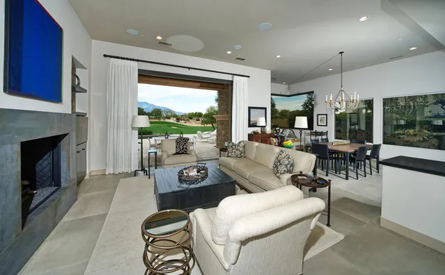 a large kitchen with a table and chairs