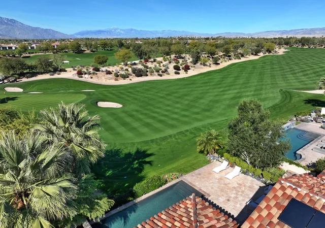 a view of a city with mountains in the background
