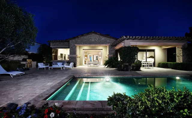 a living room with a balcony furniture and a large window