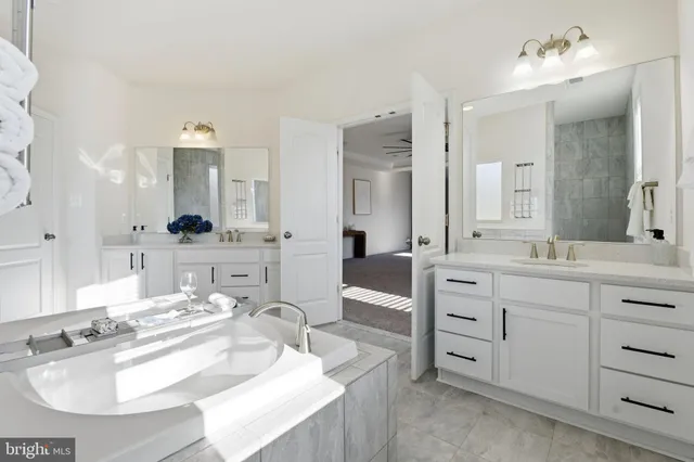 a spacious bedroom with a bed and a window